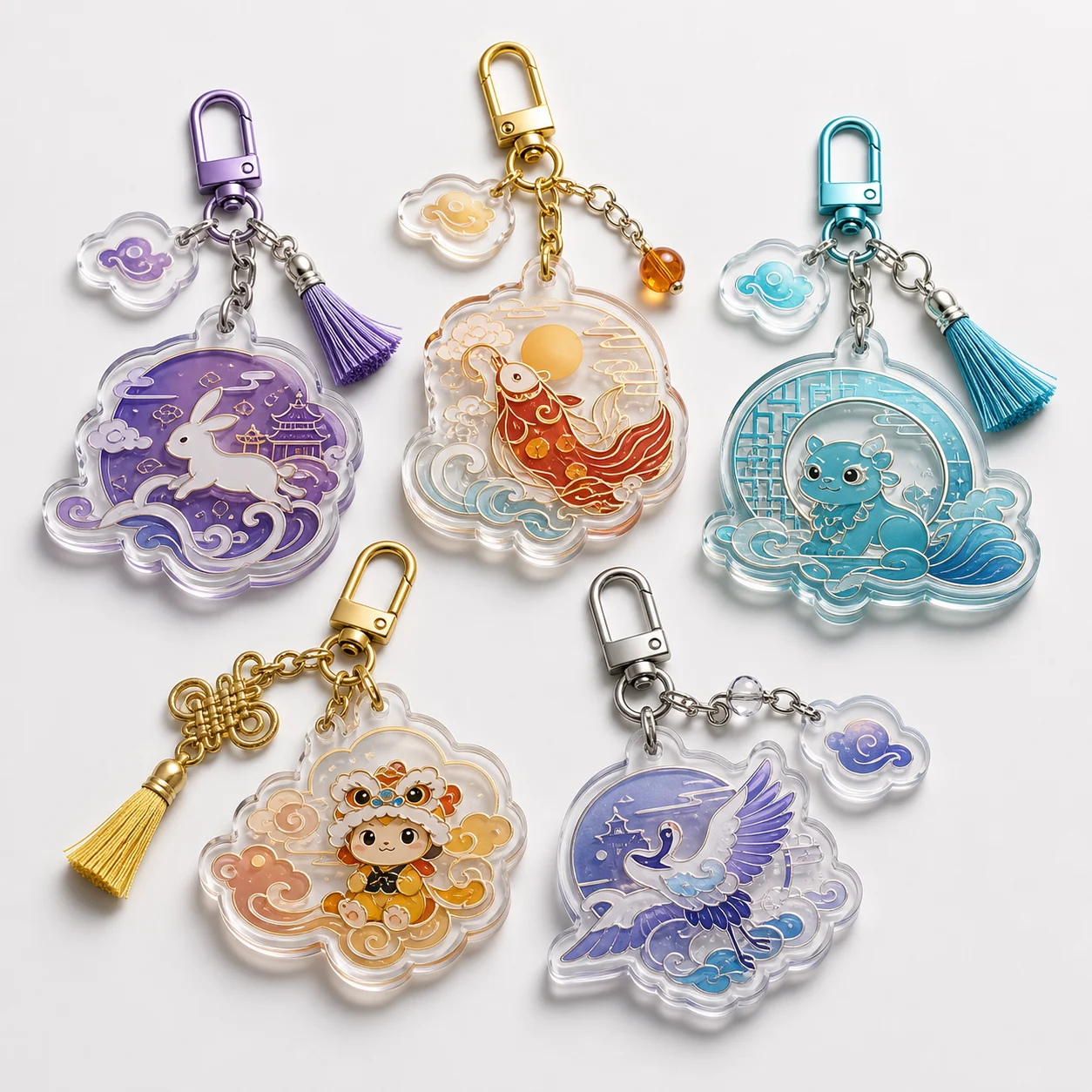 Decorative acrylic bag charms with tassels, chains, and colorful printed artwork