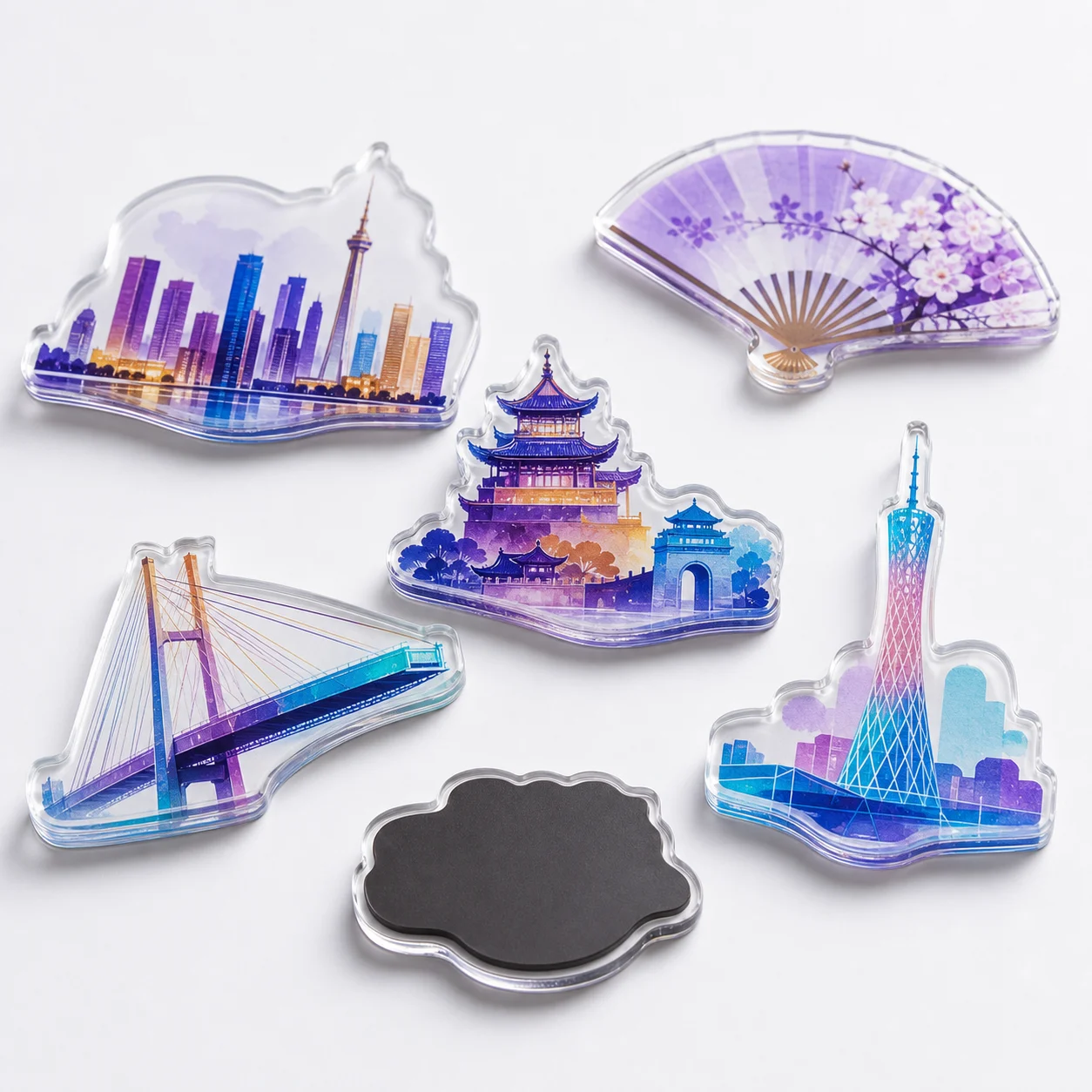 Die-cut acrylic fridge magnets shaped as city skylines, bridges, and towers